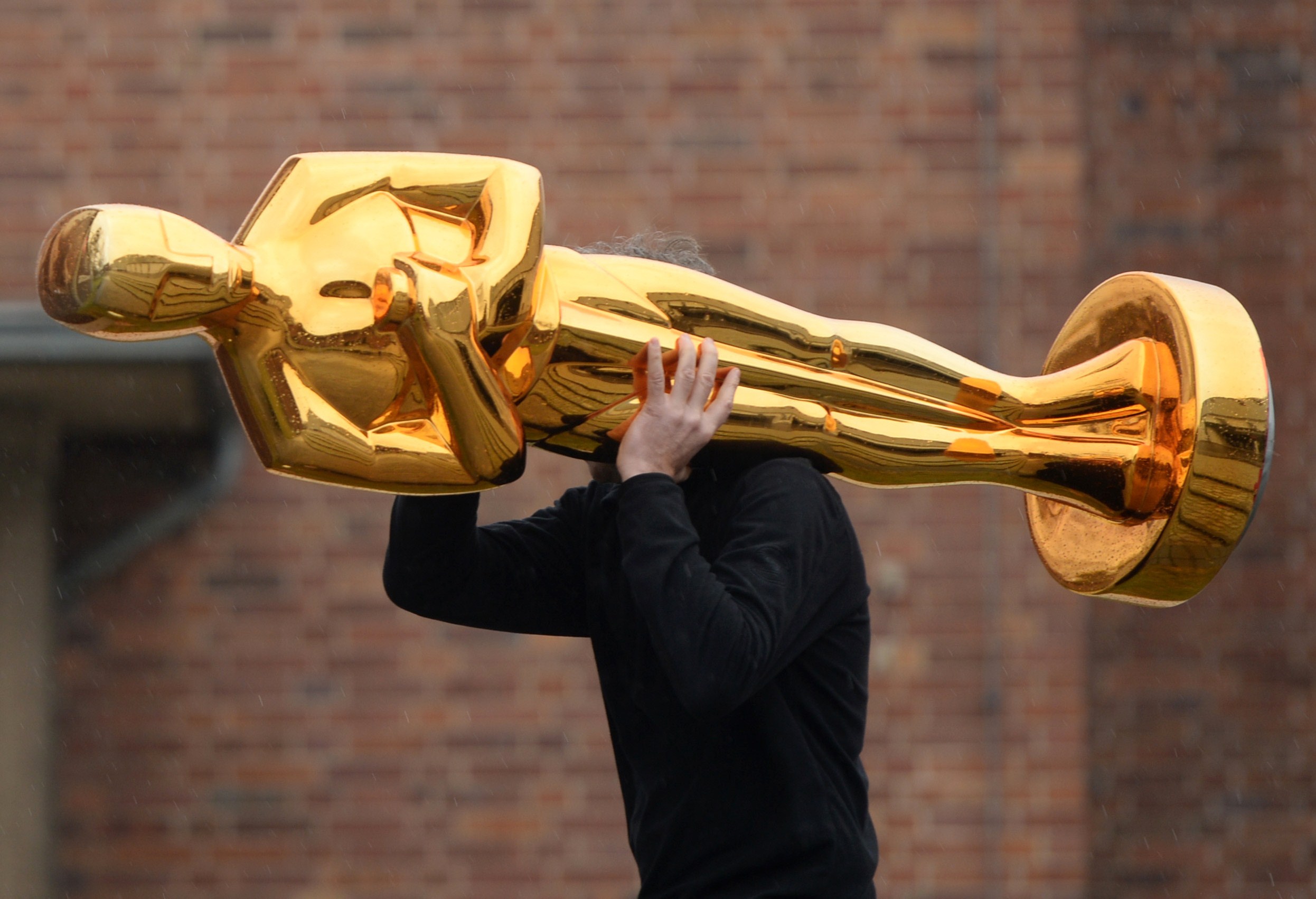 Man Carrying An Oscar